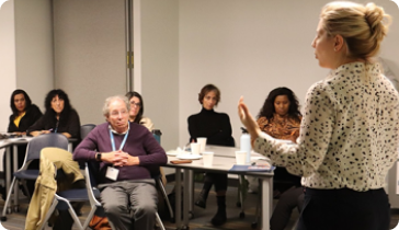 Group of diverse artists working together on community mural, collaborating on shared creative vision Multi-artist endeavors that bring together diverse voices and perspectives to create shared artistic experiences